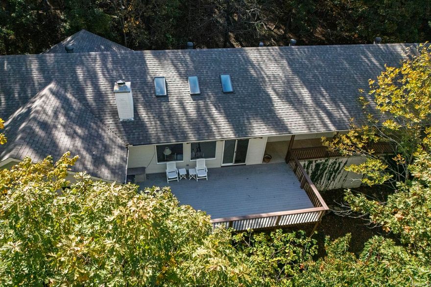 2.5% assumable mortgage. This is a very unique property sitting on 1.33 acres, you must see in person to really appreciate. A modern CUSTOM with a mid century flare. Open floor plan, high ceilings, lots of windows to enjoy the beautiful wooded scenery. Spectacular winter mountain views are just a month away. The Chefs Kitchen is situated perfectly to interact with your guests when you have them or to just appreciate your surroundings in solitude. All appliances convey and the pantry gives you all kinds of bonus storage. 3 Bedrooms and 3 baths, all a generous size. One is set up as an office with built-in's that include a Murphy bed. Wood burning stove in the family room as character and makes for a cozy winter. Large laundry/mud space and an oversized garage. Wider driveway with extra parking areas. Roof December 2024.