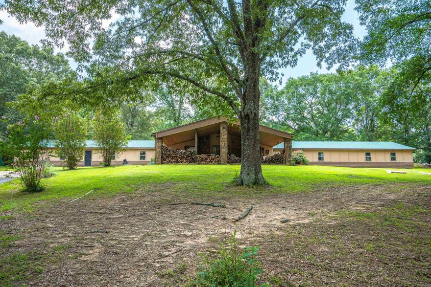 LISTED AT $49.15/sq ft!!!!!! This property is currently being used as a residence, but also has endless income opportunities..short term rental, event venue, apartments, rehab center, retreat venue, the list goes on. There are 4 rooms currently being used as bedrooms. There are multiple other rooms that can bedrooms very easily or a multitude of other possibilities.There are 3 full bathrooms and 7 half baths that are currently usable, however the structure is plumbed for 17 half baths. The master bathroom is unfinished. There is approximately 900 sq ft of unfinished garage/workshop space. Such a unique property! It is a must see!! Seling as is