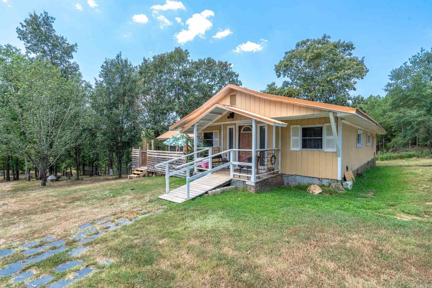 Beautiful 5 acres in Lake Hamilton School District. Cozy 3 bed, 2 bath home with a mobile home on the property.