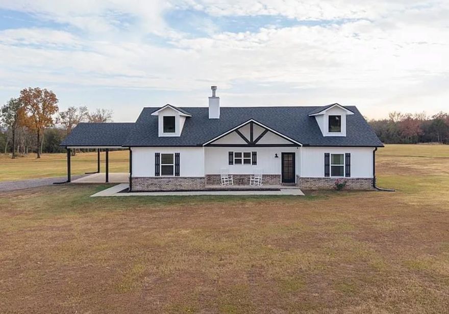 Beautiful country home built in 2022 on a serene 40 acres!! Entire 40 acres is fenced. Insulated 40x30 shop with air and heat (wood burning stove). There are solar panels on the shop that run the shop and the house providing you with a minimal monthly electric bill. Propane-powered whole-home Generac generator so you will never lose electric. Incredible property with views of Mt. Magazine, must see to appreciate.