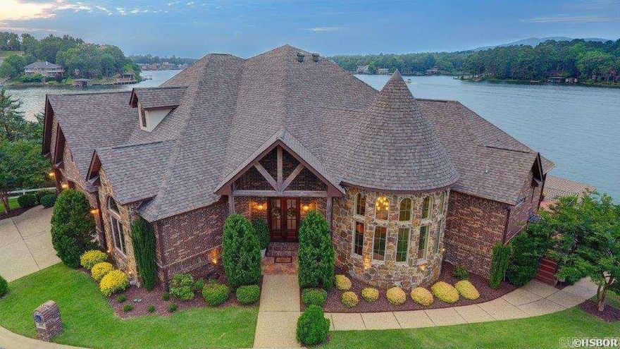 Presenting 295 Sparling, an exquisite waterfront estate in Hot Springs, AR on beautiful Lake Hamilton. This luxury residence boasts 5 bedrooms, 5 1/2 baths, 2 stall boat dock, PWC dock, and over 100 feet of lake frontage, and a 3-car garage. The grand entrance, gourmet kitchen, and spacious bedrooms offer unparalleled elegance. Outside, the expansive outdoor living area provides stunning lake views. With direct access to the lake, indulge in boating and fishing. Don't miss this opportunity to own a prestigious lakeside retreat. Schedule your showing now for a glimpse of waterfront opulence.