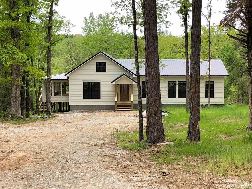 Piney Creek!! Absolutely Beautifully finished house on Piney Creek. Approximately 300 Ft. of Piney Creek Frontage. This is the perfect getaway from the Rat race. Nestled in the trees with great views of Piney creek and a short trail to the water where you can dip your ties in the creek and watch the Kids splash and play in the water. Vaulted ceilings in the Living Rm and Kitchen and 9 Ft ceilings throughout the rest of the house. White washed shiplap walls with dark wood stained beams and chandeliers that give a luxurious but rustic feel. The Master suite is all about relaxation. Enjoy setting out on approx. 600 sq. ft. of deck enjoying the sound of the creek and cooking out with friends and family. The house has Foam insulation and is set up for a Generator. This property is Ready to enjoy today.