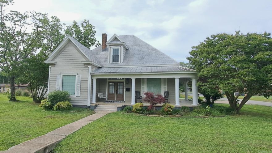 From the tin roof to the wrap-around porch, you can see the traditional style. A thorough remodel around 2013 has made the interior a magazine-worthy home. The remodel included all new electrical, plumbing and HVAC unit. The tankless water heater was installed and the electrical panel was updated in 2023. Also included; bamboo flooring, granite countertops, and a claw-foot tub. Here, you can enjoy luxury details in the middle of a small community.