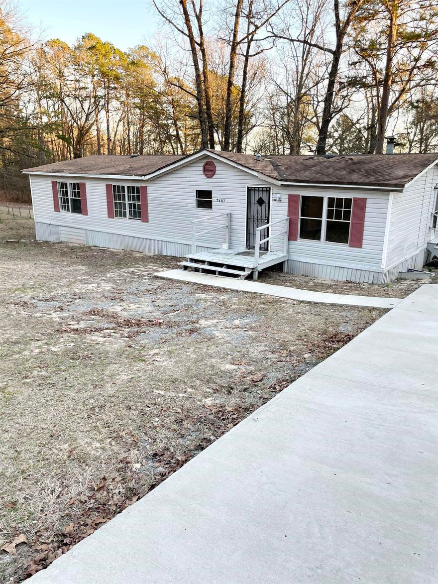 Cute doublewide mobile home sitting on a lovely acre on a country, quiet street. Needs a little TLC, but at this price you can make it your dream home! AS-IS, No seller disclosure, seller has never occupied the home.