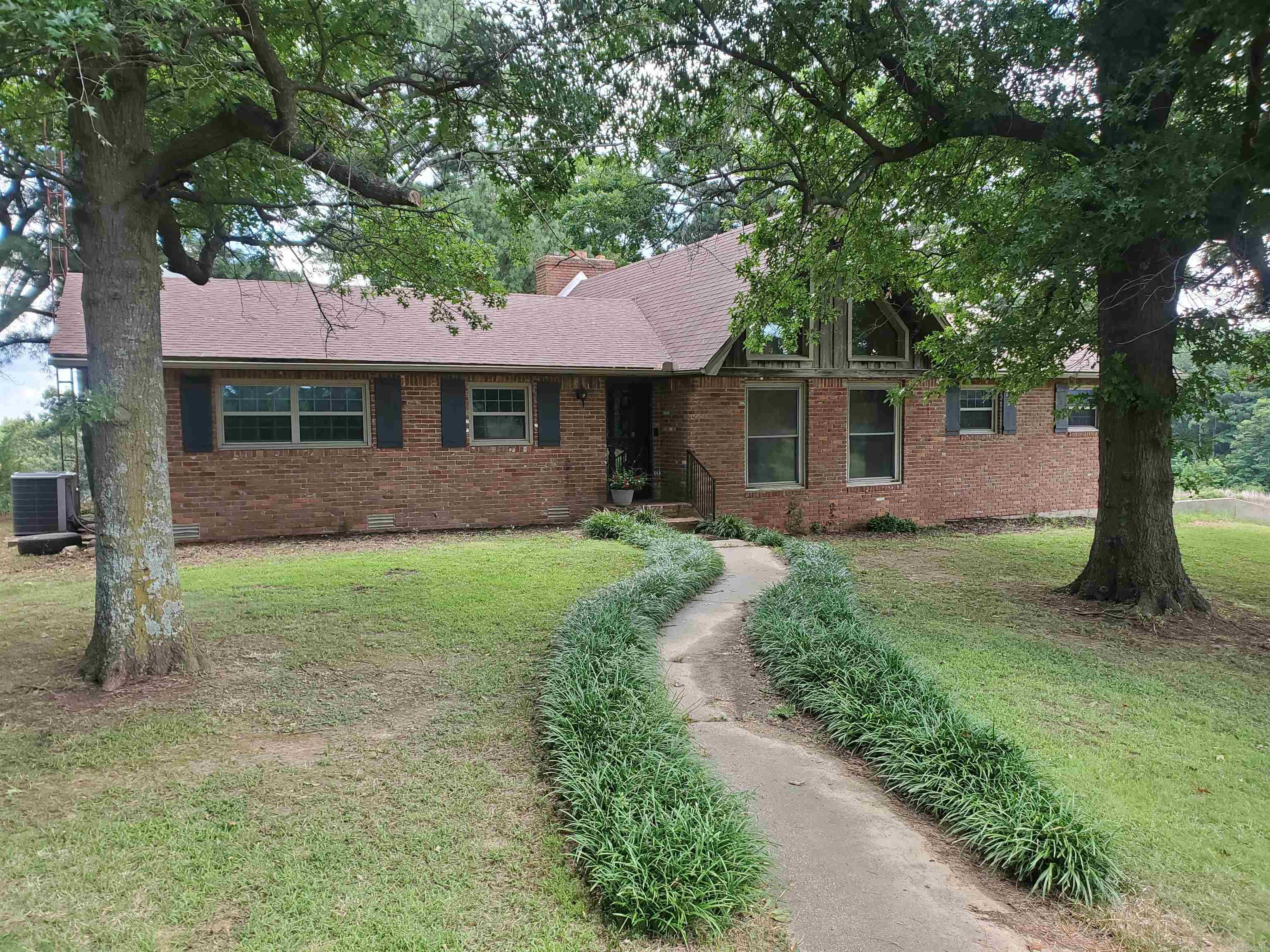 1528 CR 453 Pollard, AR. is stunning 4-BR, 3-BA dream property over-looking beautiful Crowley's Ridge in Clay County Arkansas! This extremely well maintained, 3308-SF brick home rests on 3+/- Acers! Inside this majestic home is 2-BR, and 2 full baths on the main level. A large open family room with floor to valeted ceiling windows, perfect flowing kitchen and dining room are perfect for entertaining. A large sunroom allows you to watch the wildlife while relaxing and drinking that morning coffee. Downstairs in the fully finished basement is two large bedrooms with a full bath. A one car garage opens up to a huge workspace that could be utilized in a lot of different ways! This little 3-acre slice of heaven a must see for a growing family!!