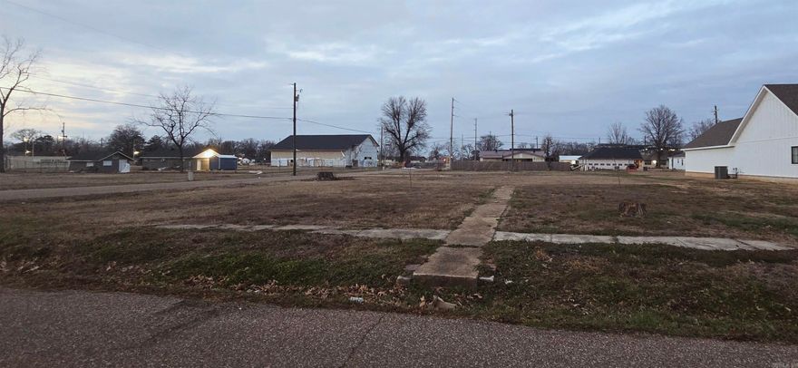Ready to build? Large corner lot (approx .5 acre) with city utilities. Close to schools.