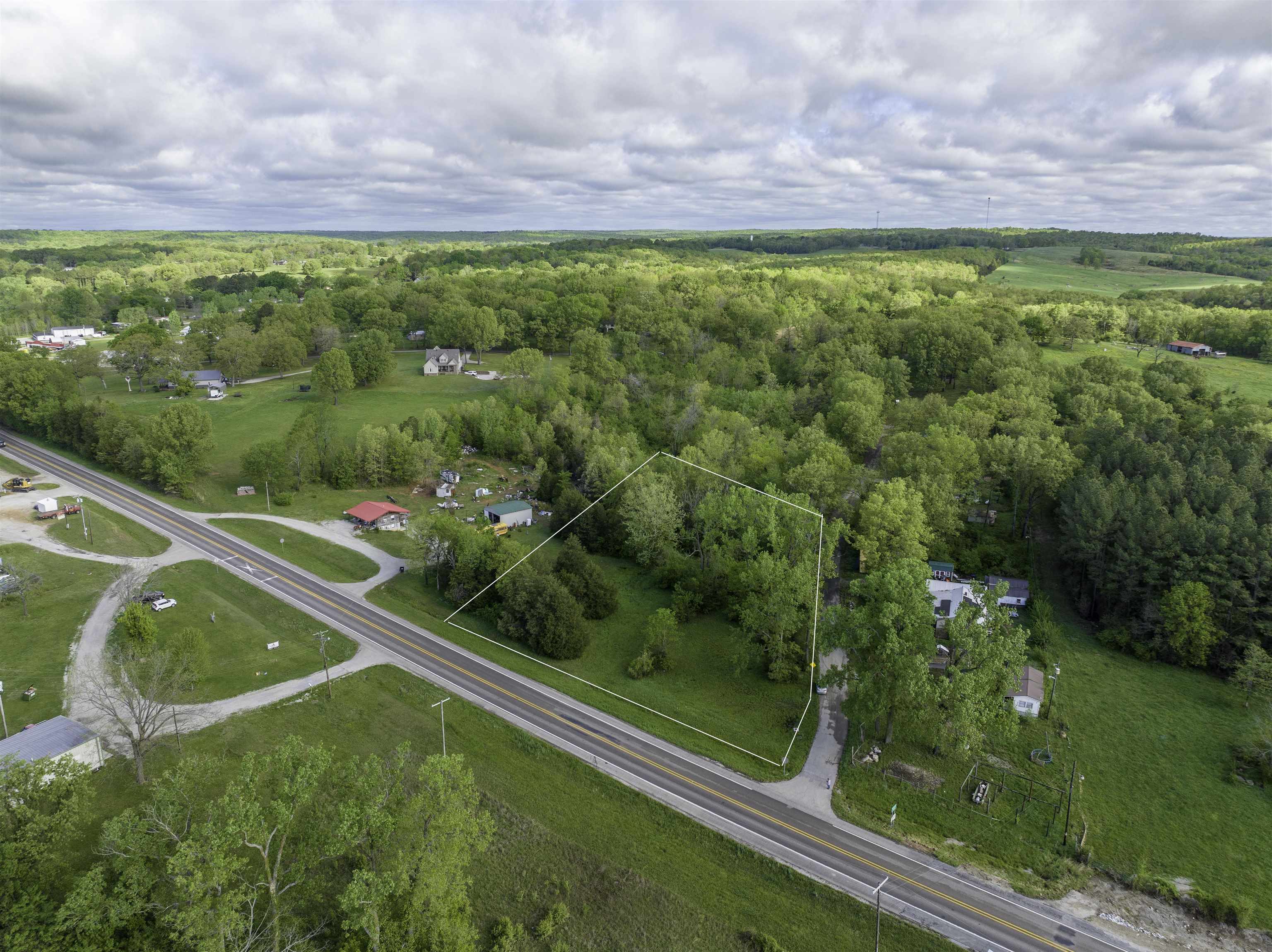 1.19 Acre Prime Lot ā Residential or Commercial Use ā US Highway Frontage in the Ozarks Unlock the potential of this 1.19-acre parcel ideally located on a well-traveled U.S. Highway in a charming rural town in the heart of the Ozarks, Arkansas. With city sewer, water, and power readily available, this flat, build-ready lot is a rare find that blends convenience, flexibility, and scenic surroundings. Whether you're envisioning a dream home, a business venture, or a mixed-use development, this property offers a strategic location with high visibility and accessibility, making it suitable for both residential and commercial use. Key Features: 1.19 Acres ā Flat and usable City Utilities Available: Sewer, Water, and Power Zoned for Residential or Commercial Use Highway Frontage for Excellent Access & Exposure Located in a Peaceful, Rural Ozark Town Surrounded by natural beauty and a strong sense of community, this property offers small-town charm with big potential. Donāt miss your chance to own a versatile piece of the Arkansas Ozarks!