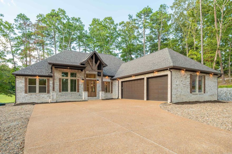 BUILDER WILL PAY DIAMANTE CLUB DUES FOR 3 YEARS, A $30,000.00 VALUE.  Carriage Homes has been awarded home builder of the year 7 times in HSV and Diamante is an award- winning golf course rated in the top three in Arkansas.  Why just live in the largest gated community in the U.S. when you can also live in a private county club.  Golf every day or as often as you choose and bring your friends and family and they can play 3 rounds of golf a month free!  Plus live in style in this gorgeous Carriage Home.  Hardwood floors (no LVP) designer tiles, elegant primary bedroom and bath with huge walk- in closet. Storage galore with walk-up staircase to attic storage. This one sits off the road for privacy and has a great view of the course.  Not many good lots left!  This is one of them!