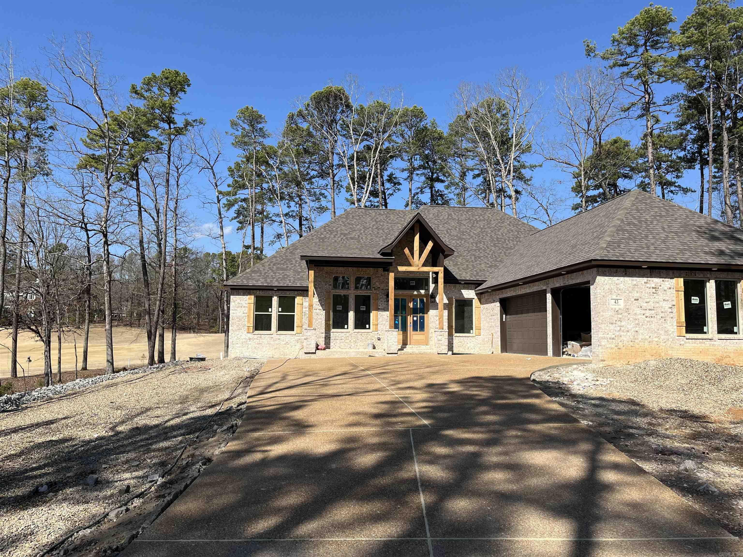 BUILDER WILL PAY DIAMANTE CLUB DUES FOR 3 YEARS, A $30,000.00 VALUE. Carriage Homes has been awarded home builder of the year 7 times in HSV and Diamante is an award- winning golf course rated in the top three in Arkansas. Why just live in the largest gated community in the U.S. when you can also live in a private county club. Golf every day or as often as you choose and bring your friends and family and they can play 3 rounds of golf a month free! Plus live in style in this gorgeous Carriage Home. Hardwood floors (no LVP) designer tiles, elegant primary bedroom and bath with huge walk- in closet. Storage galore with walk-up staircase to attic storage. This one sits off the road for privacy and has a great view of the course. Not many good lots left! This is one of them!