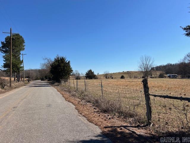 Always wanted a mini farm or already have some horses/livestock or you may just want to live peacefully on 11 picturesque acres in the country! Norris Lane offers a nice paved road and this property is surrounded by large open farms where you can watch the cattle graze. A welcoming entrance to this level acreage where there previously was a mobile (that's been removed) therefore all utilities are available. Land is mostly open with some huge, beautiful trees spaced perfectly to provide shade where it is needed like at the 30x40 horse barn! This livestock barn offers 8 stalls & a tack room with power & city water & the interior appears to be in good condition. There used to be a riding arena. There's a wet weather branch on one end of the property and access to 3 phase power if one so desired. This land is MOVE IN READY!