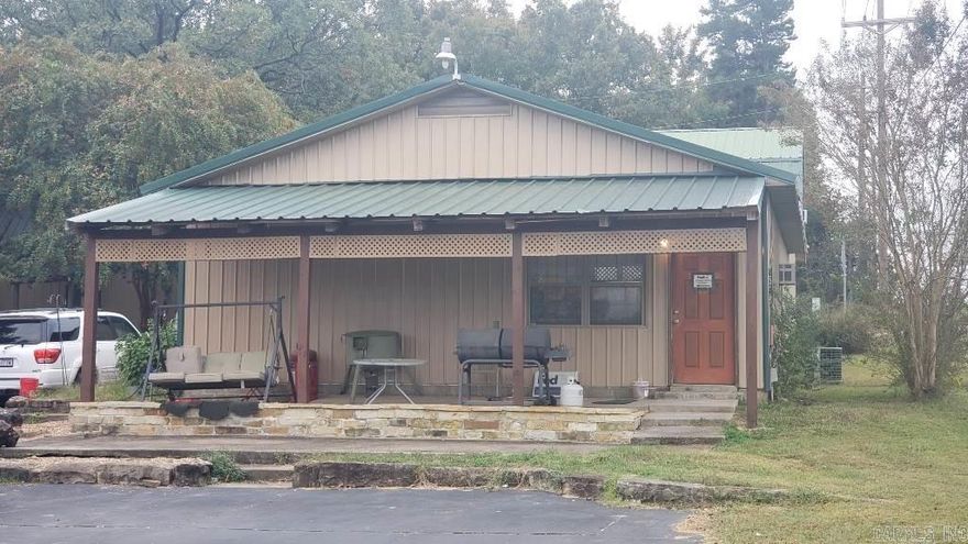 HWY 65 FRONTAGE: Commercial property located just outside of Greenbrier city limits. Bottom level is currently occupied by established business that has been on a month-to-month lease for over 15 years and upper level is occupied as a month-to-month residential lease. Recent upgrades include: downstairs main AC unit replaced in 2023, upper/lower window units replaced in 2023-24, downstairs water heater replaced in 2024, porch awning and septic lines replaced in 2022.