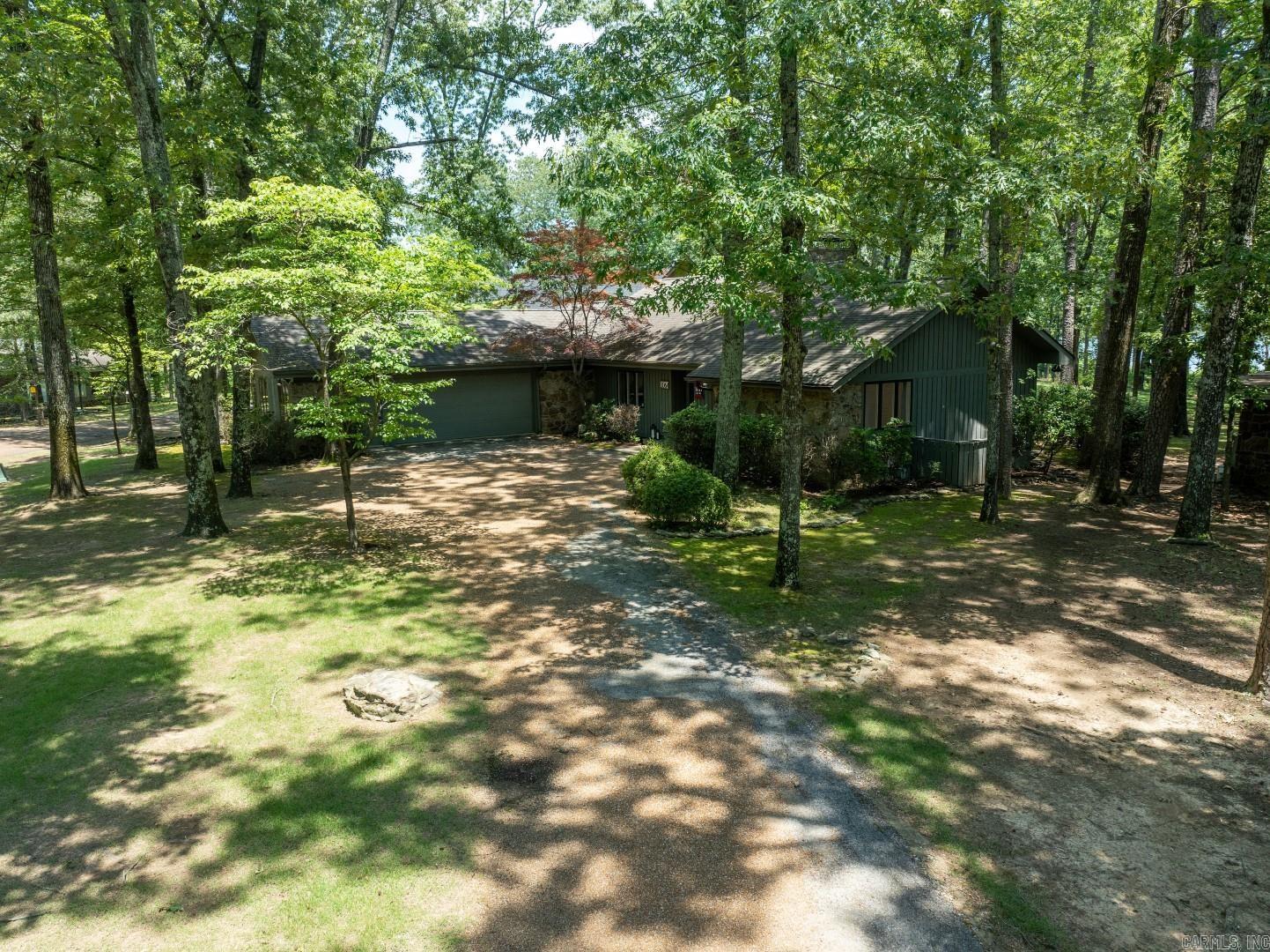 Eden Isle LAKEFRONT! This lovely 3-bedroom/3-bath home has been completely updated and is completely furnished! Located just north of Eden Isle Marina, this is a highly sought after location with great lake views, large open floorplan, cathedral ceilings and stone fireplace, split bedroom plan, very large 2-car garage, lovely covered back deck and tons of glass! Inside and out...all is in excellent condition! ***Sale price was $1,050,000 for the house and 65k for the furnishings.