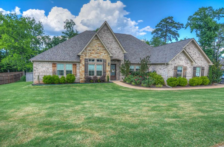 Beautiful 4-bedroom, 3-bath home with office and formal dining in the highly sought-after Glencairn subdivision, just outside city limits in Lakeside School District. Built in 2019, this 2,724 sq ft home offers an open-concept layout with vaulted wood plank ceilings, modern manufactured hardwood floors, and a spacious family room with fireplace. The kitchen features honed matte quartzite counters, gas cooktop, island bar, double ovens, pantry with pull-out shelving, and new dishwasher (2025). Split bedroom floor plan, three-car garage with floored attic, and fenced backyard with covered patio, vegetable garden, and wildflower garden. In-ground sprinkler system on separate meter. New roof in 2023. HOA $500/year.