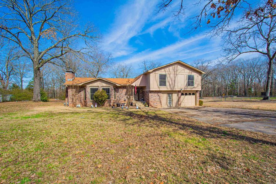 WOW!  2.51 ACRES in the heart of Sherwood. Needs a little updating but priced $12K below market value.  Four bedrooms, 2 baths, Oversized den with a beautiful Rock wall fireplace, formal dining room and an eat in kitchen.  Downstairs there is another large living area with a built-in wrap around bar that is great for entertaining. Covered back patio overlooking a fully fenced yard with a TRUE shop with two garage doors.  Above ground pool.  Main house has a two-car garage but one has been converted to an office/multifunction room.  Could be converted back to 2 car garage.