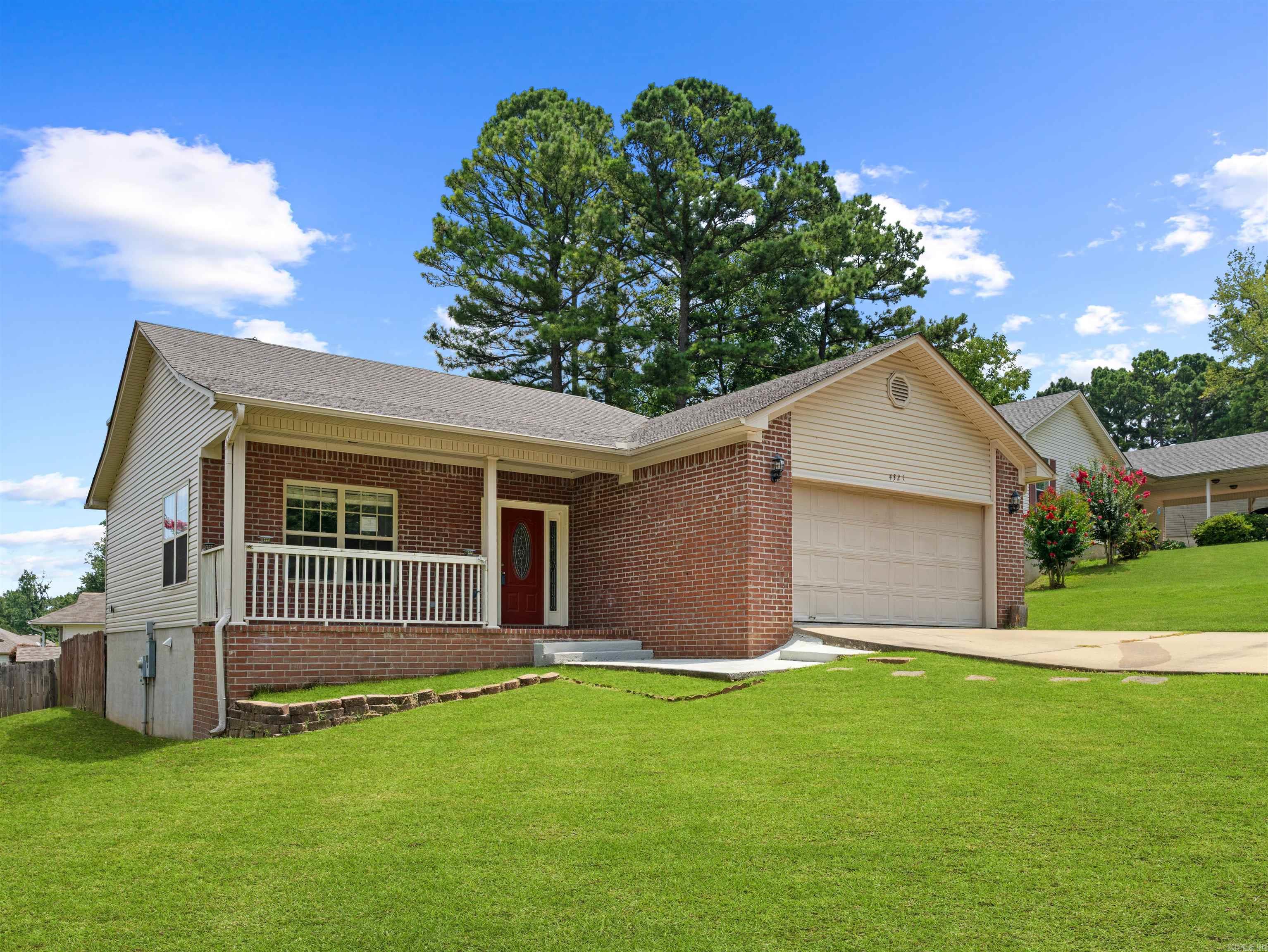 Welcome Home! You will LOVE relaxing on the cozy covered front porch of this charming Three Bedroom, Two Bath Home. Step inside to an inviting open floor plan that seamlessly connects the spacious living area with beautiful hardwood flooring and gas fireplace to the eat in kitchen featuring custom cabinets, updated appliances and breakfast bar perfect for casual meals or entertaining. The remodeled bathrooms are sure to Wow You! The new carpet adds comfort and fresh feeling, Step out back to enjoy the fenced yard with a deck ideal for outdoor gatherings, gilling or simply unwinding. This move in ready home is waiting for you.