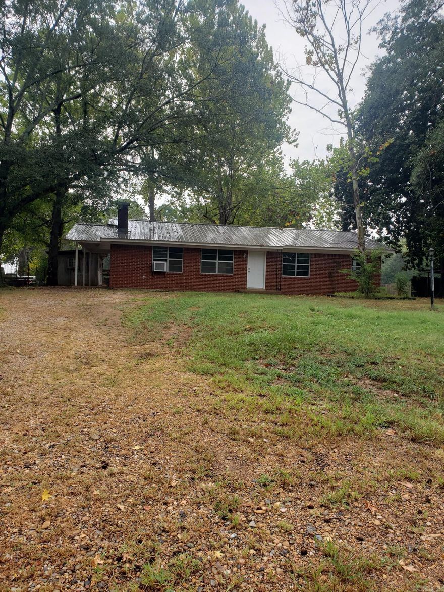 Neat little brick home has new flooring and roof. Great investor or first time buyer. New whole house window heating and cooling unit