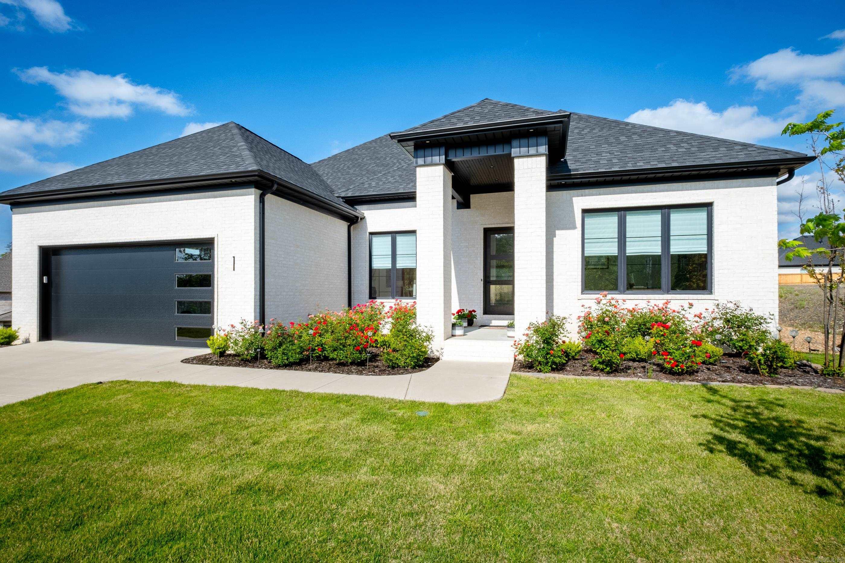 Experience modern luxury at its finest in the supremely located 1 Corlay Drive, nestled in the central cul-de-sac with common ground on the northwest side. Completed in 2022, this exquisite residence has been meticulously crafted with an open floorplan and thoughtful upgrades to elevate your living experience.Step inside to discover an enclosed covered porch, seamlessly integrated with flooring and equipped with heat/air for year-round enjoyment. Enhancements continue throughout the home with the addition of walk-in showers in two guest baths. Gas and electrical capabilities have been added to accommodate a generator, ensuring peace of mind during unexpected power outages. Hunter Douglass blinds adorn the windows, offering both privacy and style, while a tankless hot water heater ensures a continuous supply of hot water, catering to the needs of modern living. Storage abounds throughout the home, providing ample space to keep your belongings organized and easily accessible. Whether it's a spacious pantry in the kitchen or custom closets in the bedrooms, you'll find storage solutions to suit your lifestyle. Come and make this exceptional home at 1 Corlay Drive yours!