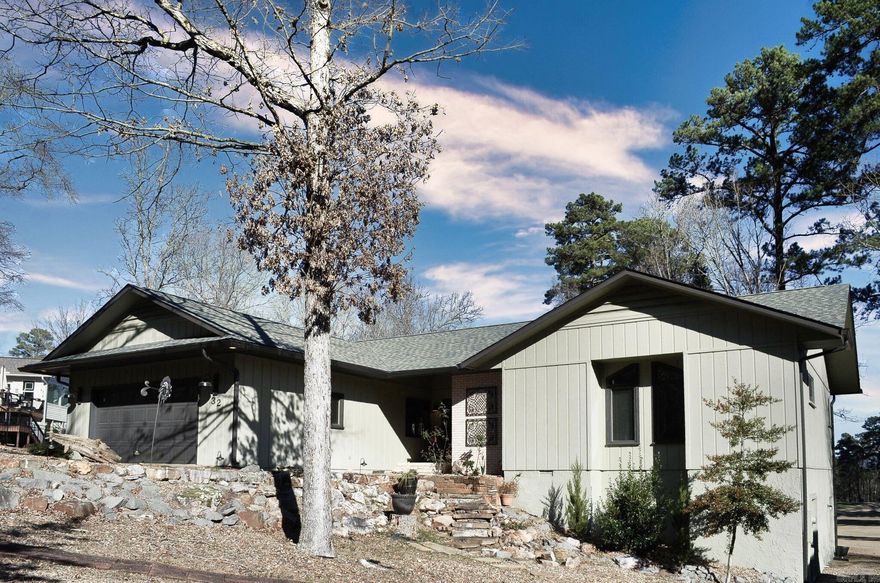 Incredible Cortez Golf course lot....This 3 bedroom 2 bath home offers the rare opportunity to look down the entire 16th hole with Goose Pond mountain in the distance. Recently updated flooring, windows, exterior and interior paint plus HVAC 2023, Roof 2024, soffet/gutters 2025 and deck 2026. Oodles of storage for all your treasures. Additional 320 square foot heated/cooled workshop/storage/hobby space. Open floor plan with breakfast bar, eat-in kitchen area, dining area and large living room. Primary suite welcomes you with a jetted corner tub, walk-in shower, duel vanities and private water closet. Expanded deck completed in 2026 with cable system rails to enjoy the vista view. Hot Springs Village Property owner Association has a new member buy-in fee of $2,000.00 due and collected at closing.