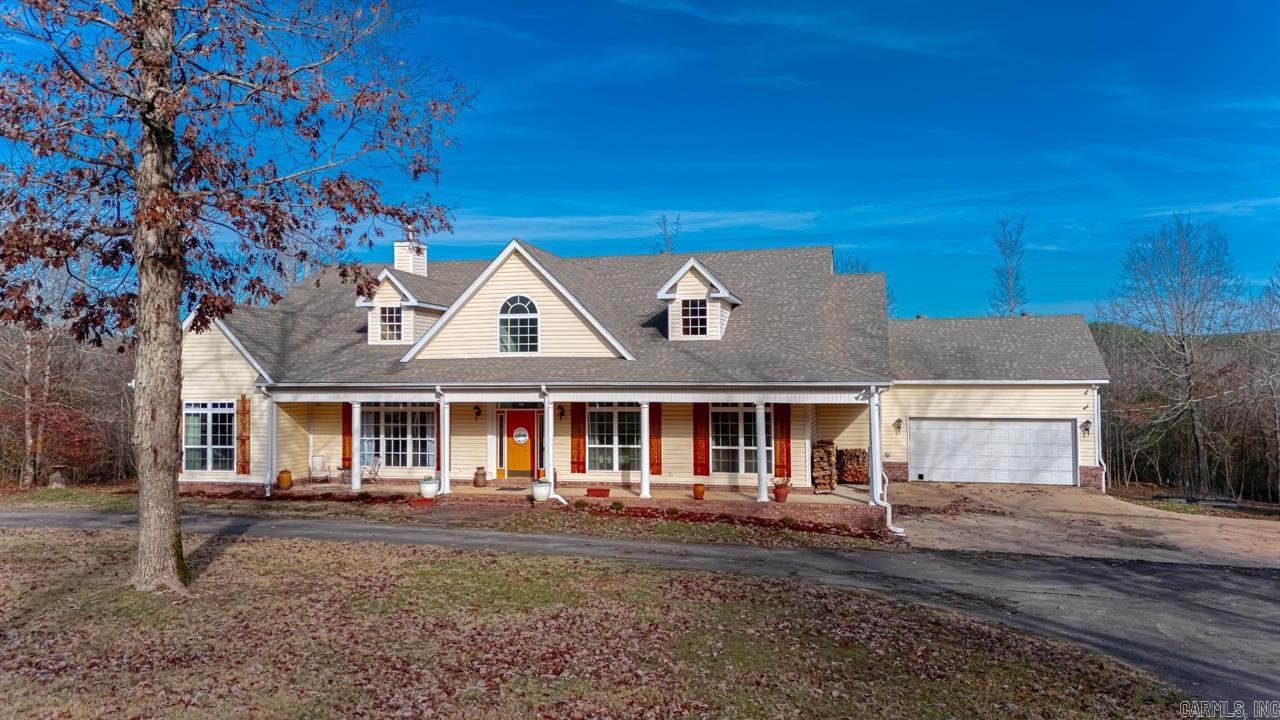 Nestled on a picturesque 9 acres, this 4-bedroom, 4-bathroom home offers the perfect blend of modern luxury and serene country living. With 4,422 square feet of thoughtfully designed space, this 2-story residence has been tastefully remodeled.  The open-concept layout invites you in with a recently updated kitchen featuring a large island, breakfast/reading nook, and seamless flow into the dining area and great room. A screened-in porch extends off the kitchen, providing a peaceful spot for outdoor enjoyment and looks onto a deck. Just off the living room, you’ll find a dedicated office space. Large windows and a grand, light-filled entryway create an airy, sunlit atmosphere throughout the home. Upstairs, there is a versatile bonus space & bathroom. Nature lovers will appreciate the peaceful surroundings, including a fire pit, complete with wildlife sightings. Shopping, dining, and modern conveniences are approximately a 20 minute drive. Recent upgrades include a new HVAC system (2022), a well head replacement (2022). Induction range, convection oven, & vent hood (2022), Bosch dishwasher (2024); Roof 2018