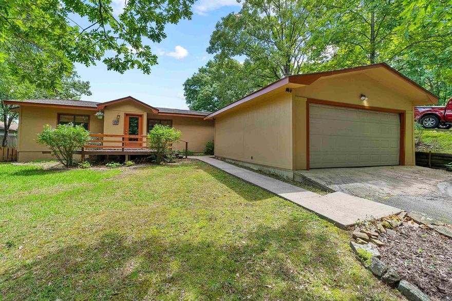 Lake Front Property on Lake Conway with a Private Boat Dock with a Covered Slip! Enjoy the Peace & Quiet of the Lake with a Beautiful Lake View from your Back Deck, Inside the Sunroom, or even the Screened in Porch.  3 Bed and 2 Full Baths. Newer Roof (2 Years Old). Newer Heat/Air System (5 Years Old). Open Living Room Focused on the Fireplace and Lake View w/ Original Hardwood Floors and Cedar Ceiling.  Open Eat-In Kitchen w/ Stainless Steel Appliance, New Stove, Pantry and Fridge to Coney. Primary Bedroom w/ Large Walk-In Closet. Spacious Laundry Room w/ Built-Ins for Extra Storage. Gas Dryer and Washer will Convey. These Properties Don't Come Around Very Often So Setup Your Viewing Today! See Agent Remarks.