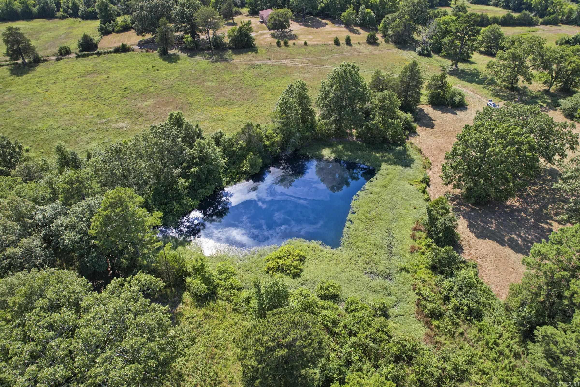 Looking for the perfect spot to get away, explore, and build your dream getaway in the small warm & welcoming town of Mena, Arkansas situated within the Ouachita mountains and National Forest! This private, yet, easily accessible property offers the perfect blend of seclusion and convenience, just a short few minute drive from town. With breathtaking mountain views all around, multiple stunning building sites, and a peaceful pond, this land is an ATV & outdoor enthusiast's dream paradise! ATV’s can easily be ridden to trails! The property features a mix of wooded areas and open spots, providing both shade and plenty of room to roam. You'll find an abundance of wildlife to enjoy, plus the freedom to ride your ATV’s directly from the property a few miles to the nearby Wolf pen trails, creeks, and the Ouachita River. The 1.8 million acres of Ouachita National Forest is just a stone’s throw away, offering endless adventure and exploration. Electricity is already available on-site! . Need more space? An additional 40-acre parcel borders this property, offering even more room for your mountain retreat. This land has it all—privacy, access, views, wildlife, and adventure—don’t miss out!