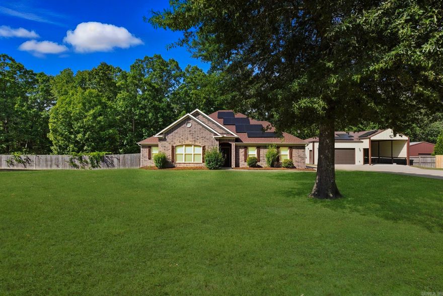 Beautiful home with a Huge Shop and RV Storage! This home has a fantastic split floor plan with plenty of natural light including 4BR & 2BA down and a Bonus Room upstairs all spanning 2,476 sq ft in the Hickory Nut Ridge subdivision in Bauxite! The living room features a Beautiful Gas Fireplace (propane) providing warm comfort during those chilling seasons. The upstairs Bonus Room can be set-up as a Home Office, Family Room, Bedroom, or other. The spacious kitchen features a Large Eat-In area (great for entertaining), Granite Countertops with Breakfast Bar, Under Cabinet Lighting, Gas stove, Large Walk-In Pantry, Deep Drawers, and drawer space to keep appliances for a clean counter. The Primary Bedroom has a beautiful Triple Tray Ceiling, Custom Tiled Shower, Jacuzzi Tub, Private Water Closet, Double Vanities, and a Huge Walk-in Closet! Covered patio/deck backs to greenspace! The foam-insulated and heated shop measures a huge 24.7’ x 37.75’! Adjacent covered RV storage with electrical hookup measures 17.8’ x 43.75’. Solar panels virtually eliminate the electric bill! Gas stove and Fireplace are propane-fueled. Make this fabulous home yours – schedule a private tour today!