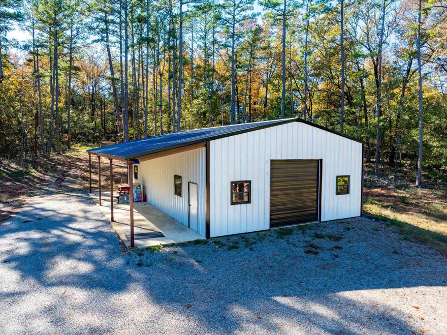 If you’ve been searching for small acreage with a new shop house, this is it! Located just outside Evening Shade, Arkansas, between Evening Shade and Cave City, this 13± acre wooded property sits on Highway 56, only a half mile from Highway 167—offering both privacy and convenience. Built within the past year, this modern 1-bedroom, 1-bath shop house was designed for simplicity and easy upkeep. It features an open floor plan that combines the kitchen, living, and dining areas, plus a roll-up door that opens the space for entertaining or enjoying the outdoors. The lean-to porch on the side provides a shaded area perfect for relaxing. Constructed with metal siding, metal roof, and concrete floors, this home is low-maintenance, energy-efficient, and durable—ideal for full-time living, a weekend getaway, or a hunting basecamp. Everything is all on one level, and it’s wheelchair-accessible, offering comfort and convenience for any lifestyle. The 13 wooded acres provide seclusion, space for recreation, or potential expansion. Whether you’re looking for a manageable homestead, a cozy rural retreat, or a property to enjoy the outdoors, this one checks every box.