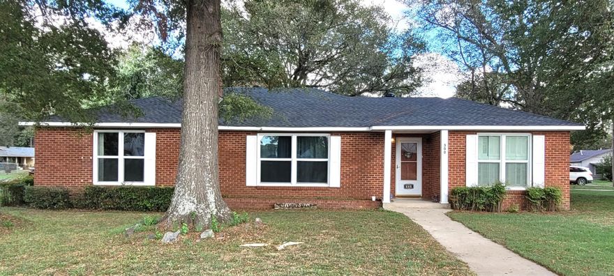 Recent updates in this spacious 2294 sqft brick home include a new roof in 2023, new HVAC 2024, and new windows approximately 5 years ago. The 3 bedroom 2 bath home sits on a half acre corner lot and has great outdoor storage in addition to an impressive 25x50 metal shop! Large windows, hardwood floors, and built-ins bring natural light and character into the space with a tree-shaded corner lot adding sigificant curb appeal to the home's exterior. The maintenance improvements - roof, windows, HVAC - have already been done for you! This leaves more room in your budget to update and customize the interior to make it your own. Take a tour and see if this is the one you've been waiting for!