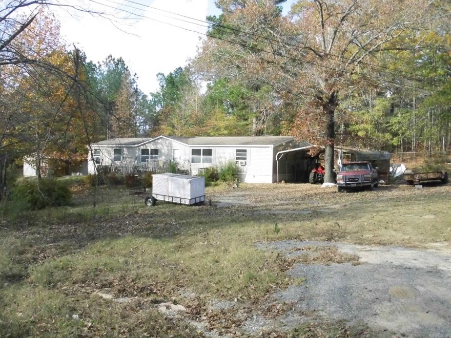 **Large MH sitting on almost 3 acres**Seller relocating so property to be sold "as-is". Needs some TLC but has great potential**Two large living areas**Split bedroom plan**Master suite features large walk-in closet, soaking tub and separate shower* Additional 16 x 20 add-on room was used as a 4th bedroom**Central heat and window units for A/C**Exterior features covered carport and shop building*Country living in Sheridan School District but only 15 minutes to Little Rock, Benton or Bryant**Agents see remarks**