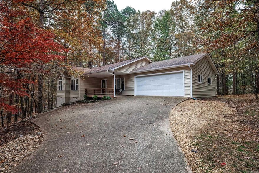 Centrally located in a private setting sits this immaculate home. Open the door and you will be amazed!  Walk in to a vaulted great room that opens to the dining are that opens to the kitchen with beautiful updates. No popcorn ceilings in main part of home, new interior paint, luxury vinyl plank in great room, dining room and kitchen.  White kitchen cabinets with new hardware, granite counters, sink, faucet, garbage disposal and lighting.  New appliances. New dining light. Mounted tv's convey. Electric vehicle charger in garage. Relax on front porch or the rear deck. Make this one your weekend getaway home or your primary home - all the work is done!  Heat pump 2021.