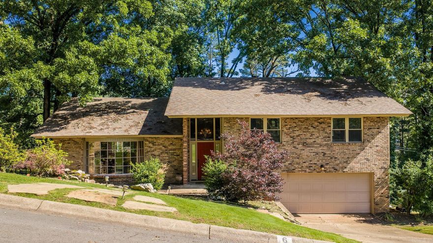 Escape to this Tree house in the heart of Leawood. Flagstone steps welcome you to the water feature at the front door. Short commute to UAMS, and shopping/dining. Traditional Split level with hardwood floors & tile (no carpet) Windows, roof and updates all completed in last 6-8 years. Multi tier deck overlooks the tree lined landscape, w/flat area w/playset. Kitchen, dining & living all semi open concept, with granite countertops & stainless steel appliances.