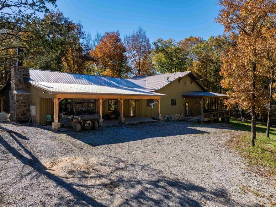 If you are searching for a true turnkey hunting property in the Arkansas Ozarks, this 300+/- acre tract just outside Batesville is the real deal. Located off Sandtown Road and B Rock Road, the property sits at the dead end of the road, offering excellent privacy while remaining just minutes from town. At the heart of the property is a custom hunting lodge featuring two complete living quarters under one roof, ideal for large hunting parties or multiple families. Each side includes its own living area, kitchen, bedrooms, and bathrooms.A wraparound porch offers scenic views, while a central hallway with oversized mudroom/laundry area provides space for boots, gear, and hunting equipment with exterior access.An additional livable home near the entrance offers guest or caretaker space. The land has been intentionally developed for hunting with a road and trail system, established food plots, deer stands and feeders already in place, cleared pasture areas converted to plots, a creek providing year-round water, and extensive timber for bedding and travel corridors.All stands and feeders convey, making this a true walk-in-and-hunt property. The diverse terrain supports strong populations