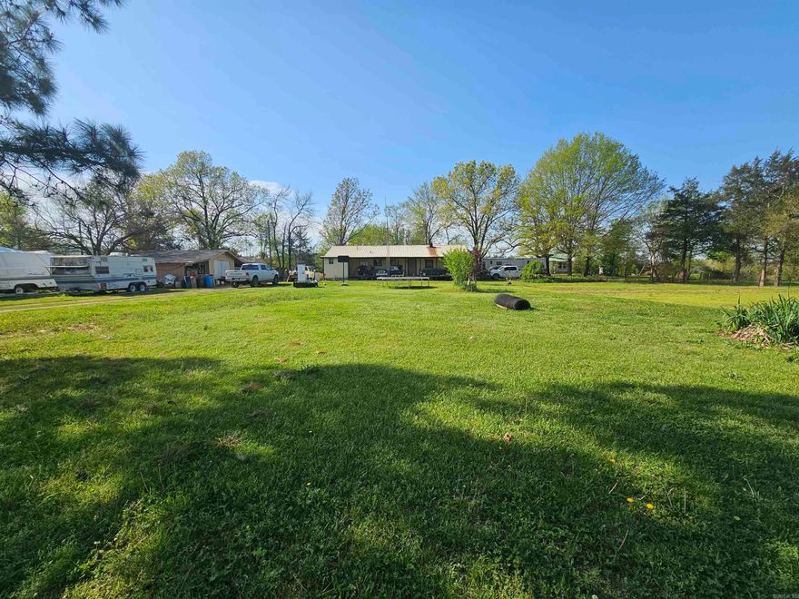 NEW PRICE AND MOTIVATED SELLER!! Completely fenced yard with multiple storage buildings, shop, wonderful garden area, 2 wells, ornamental trees, 4 bedroom, 2 bath, laundry room and kitchen has lots of cabinetry.  Agents see remarks