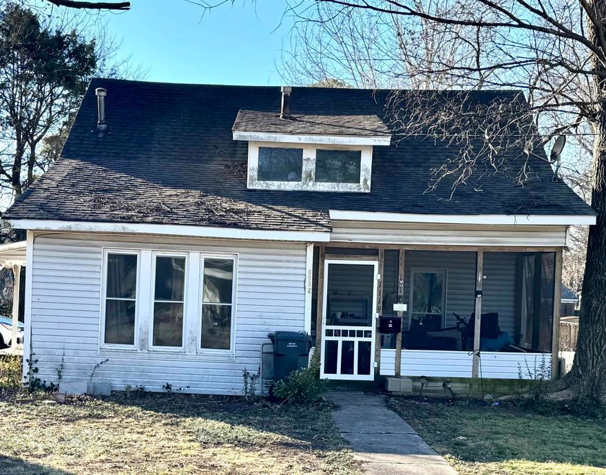 West End Opportunity at Madison & Elm, just steps from the Jonesboro Public Library, Downtown Jonesboro, and Jonesboro schools. 3 bed, 1 full bath, plus a bonus area upstairs currently used as an additional bedroom. Screened-in porch, newer central heat and air, hot water heater, and all appliances stay. One owner since 2008. Ideal as an investment property or home ownership under $100,000! Priced to move and sold AS IS. Schedule your tour today!