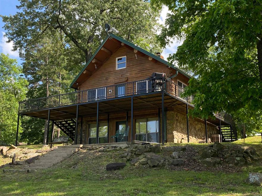 Nice lake view, lakefront Log home on Greers Ferry Lake in beautiful Skypoint Subdivision.  Low white line with easy walk to water.  Enjoy the  great view from the big lakeside deck.  This is a must see. Would make a great Lake house or Vacation Rental. Nice subdivision, quite neighborhood. Drive by and give us a call today.