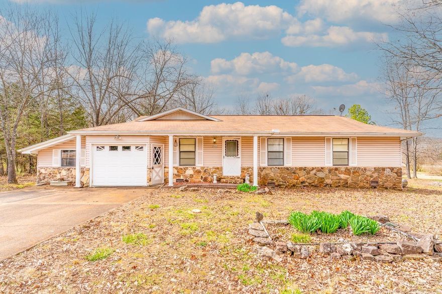 Welcome to Market 701 Pleasant Valley Drive of the Sleepy Hollow Subdivision in Horseshoe Bend, Arkansas within walking distance of sparkling 600 +/- acre Crown Lake. Nestled in the Ozarks and situated on a .4 +/- level corner lot sprinkled with shade trees is a charming Ranchette wrapped in stone & vinyl and accented by shutters, gutters, and a covered front & back porch. Built in 1984 and containing 1,318 sf of well laid out living space that contains a large living room, eat-in kitchen w/ sliding glass doors, walk in laundry/storage pantry, Master bedroom w/ en-suite that holds a walk-in shower, spare bedroom, and spare bathroom w/ shower/tub combo. You'll love the one car garage and outbuilding for extra storage. Make yourself at home and enjoy all the community has to offer: fishing and canoeing on the Strawberry River, boating on several lakes, golf at Turkey Mountain Golf Course, tennis, sandy beaches, abundant wildlife, and star gazing. Call today to make this house your home, home away from home, or next addition to your rental portfolio.