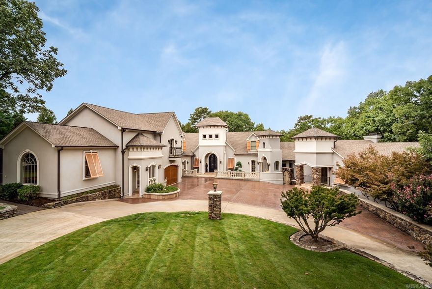 This beautiful lakefront home features a modern security system, theater, gym, sauna, wine cellar, pool, jacuzzi, outdoor kitchen, billiard room, three en-suite bedrooms, two guest wings, vaulted ceilings, Viking appliances, marble and granite countertops, and custom cabinetry.  A must see this beautiful place has it all inside and out!