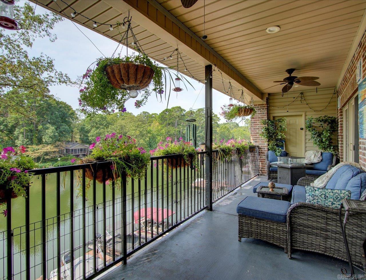 Perfect lakeside retreat in the heart of Hot Springs! This stunning 2-bed, 2.5-bath condo, nestled in the desirable Lakeland Bay subdivision, offers a seamless blend of comfort and luxury. Built in 2006 and meticulously maintained, you’ll be greeted by the rich warmth of dark wood cabinets & upscale fixtures throughout. Step into the modern kitchen with sleek stainless steel appliances & large tile floors that flow into the dining & living areas, creating a spacious & inviting atmosphere. But the real showstopper? The stunning lake views from your private deck! Imagine sipping your morning coffee with serene water views, taking a dip from the dock, or enjoying a swim just steps away. When it’s time to entertain, the condo’s amenities won’t disappoint—a covered, upscale picnic area complete with grills and a fireplace is perfect for gatherings, rain or shine. Majority of the furniture will stay. See Agent Remarks for exclusions. Utility bills are LOW. The Universal dock is available for owners to tie up their boats for a weekend, possibly longer. Agents - Call Showing service to schedule all showings.