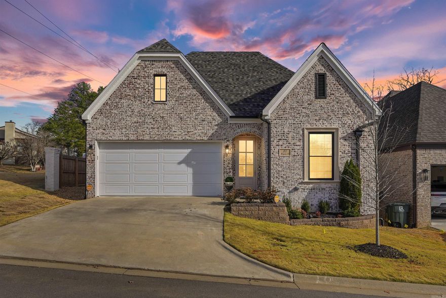Beautiful one-story home located in an exclusive, gated patio home community in the heart of West Little Rock (gate to be installed soon). Built in 2023, this home offers timeless European-inspired architecture and energy-efficient construction. Inside, white oak hardwood floors (extending into the primary bedroom), 10 ft ceilings, and graceful arched entryways create a warm, elegant ambiance. The open floor plan features a gourmet kitchen with quartz countertops, a Bosch gas range with vent hood, dishwasher & microwave flowing into the dining room and great room with a color-controlled LED fireplace. The primary bedroom suite includes a sitting room or home office, luxury spa bathroom with dual sinks, designer mirrors, soaking tub, frameless glass shower & private water closet - plus a walk-in closet with built-in chest of drawers. Two guest bedrooms are privately positioned sharing a well-appointed hall bathroom. Designed for relaxation, the backyard features a covered patio, wooden privacy fence, sprinkler system, Zoysia grass and evergreen trees.The POA maintains the gate, common areas such as the Belvedere gazebo, and private streets. Two-car garage plus so much more!