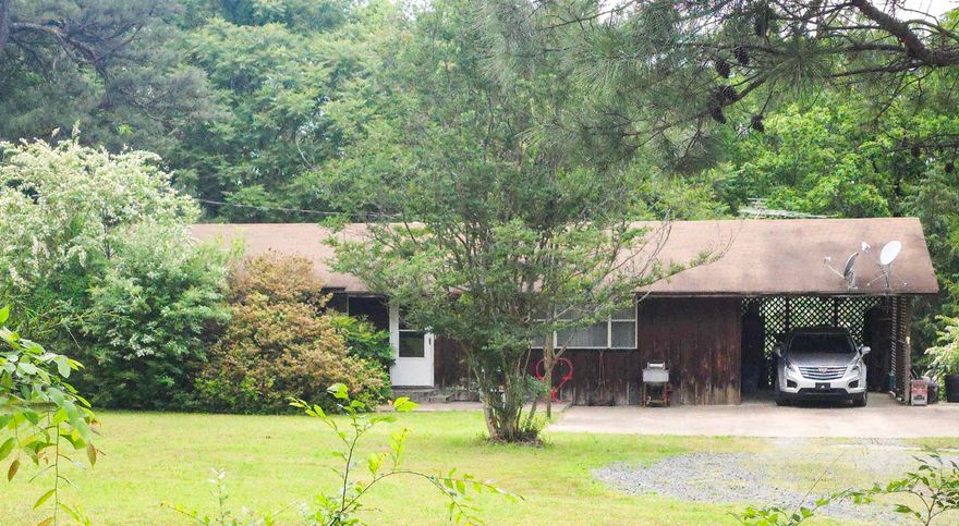 This wonderful property offers a UNIQUE OPPORTUNITY and it is just 10 minutes from Ferguson's Choctaw Marina on Greers Ferry Lake!!   The detached building sits at the top of the property with Highway 65 frontage, and was operated as a thrift/antique store for decades!! You could re-open the doors to the public or get creative and make the space your own!   The 3 bed, 2 bath home is nestled along the treeline on the back of the 1.18 acre property, with a beautiful front yard and serene back yard. Walking through the front door you are greeted by a large living area open to the eat-in kitchen with the bedrooms all down one hallway - ideal for gathering with friends and family. The covered back porch and fenced back yard are perfect to move the hangout outside, and enjoy room for kids or pets to run and play.