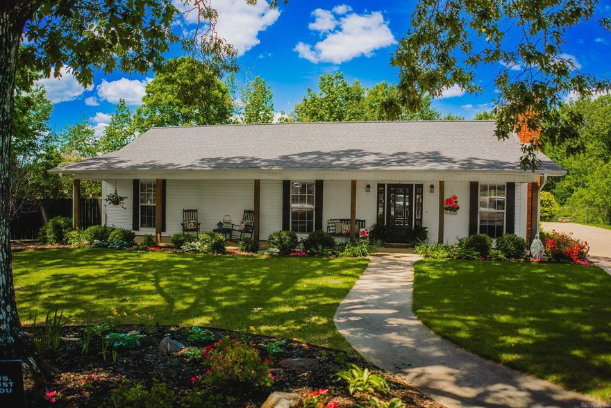 Charming and move-in ready, this 3 bed, 2.5 bath home offers 1,740 sq ft of inviting space on a tree-shaded lot. The updated kitchen features custom cabinetry and stainless appliances, and the living area includes warm wood accents and a gas log fireplace. Enjoy a welcoming front porch, back deck, fire pit, and fully fenced backyard. Bonus storage in the carport closet and shed. A great mix of comfort, style, and function—don’t miss it!