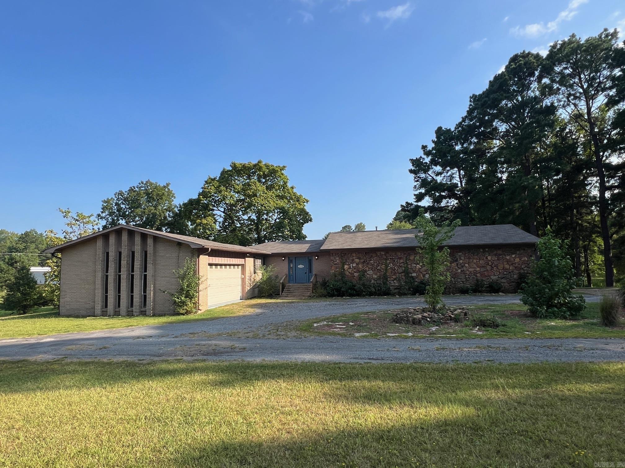 Large house, big rooms! Well built, spacious home on 5 acres. Move-in ready. Bryant schools. 5 bedrooms, 4 full baths, 3 living areas. Downstairs mother-in-law quarters with separate entry. 2 car garage up, single car garage down. See agent remarks.