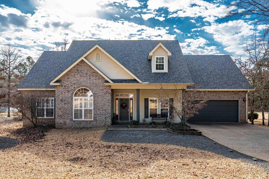 Welcome to this stunning Cooper-built 3-bed, 2-bath home perfectly positioned on the Isabella Golf Course in Hot Springs Village. This charming residence has 1,977 sq ft of living space on a beautifully landscaped 0.36-acre lot with scenic golf course frontage and views of three fountains — a true golfer’s paradise! Volume ceilings and wood floors throughout create a warm and inviting atmosphere. The spacious kitchen features stainless steel appliances, granite counters, breakfast bar, and under-counter lighting. The split bedroom plan offers privacy, while the primary suite includes a double vanity, jetted tub, and walk-in shower. Enjoy year-round entertaining on the extra-large covered deck overlooking the fairway, perfect for morning coffee or evening sunset dinners. Upgrades include a new roof (2024) with gutters & leaf guard, blue-light air filtration HVAC system, and new garage door hardware with lifetime warranty. Additional highlights include a two-car garage with workspace, separate dining room, breakfast room, and generous storage. With easy access to all POA amenities including golf, lakes, pools, fitness, and security, this home offers an exceptional lifestyle!