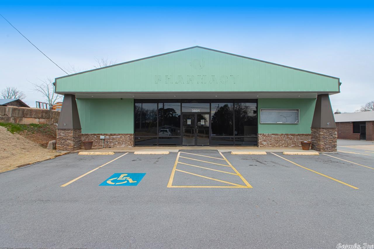 FANTASTIC LOCATION right off the interstate in Bryant! Building was updated with LVP flooring, LED lighting, & new HVAC in 2018. Building on 1.59 acres, approximately 10 parking spaces, 2 drive thru lanes with pneumatic tube system. . Zoned C-2. Storage building & canopy convey with property. Acreage behind building could be used to expand.