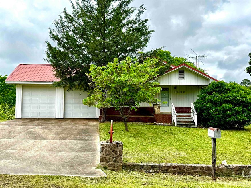This 2-bedroom, 1-bath home sits on 5± acres with a pond, offering a perfect mix of country living and convenience. Built in 1944, the 960± sq ft home features low-maintenance vinyl siding, a durable metal roof, and a spacious 2-car garage. Inside, a separate dining room provides space for family meals and gatherings. With city water and sewer, you’ll have modern comforts in a rural setting. Located just 36 miles from Hot Springs and 10 miles from Hwy 27 Fishing Village and Twin Creeks Recreation Area Campground, this property offers easy access to local attractions and outdoor activities.