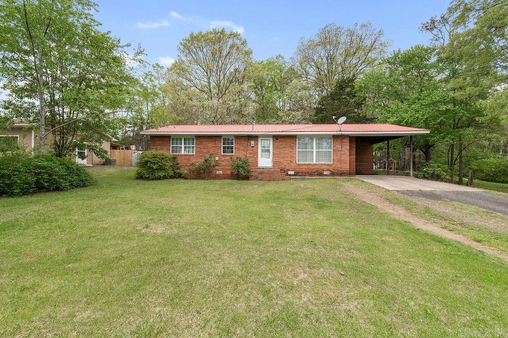 This cozy 3-bedroom, 2-bathroom home is located in a small, quiet subdivision just a short drive from town. The home offers a warm and functional layout with an open living area that flows into the kitchen and dining space. The bedrooms are comfortably sized, making the most of the square footage, and the primary suite includes its own private bathroom for added convenience. Ideal for first-time buyers, small families, or those looking to downsize, this home combines peaceful neighborhood living with quick access to local shops, schools, and restaurants. AGENTS SEE REMARKS