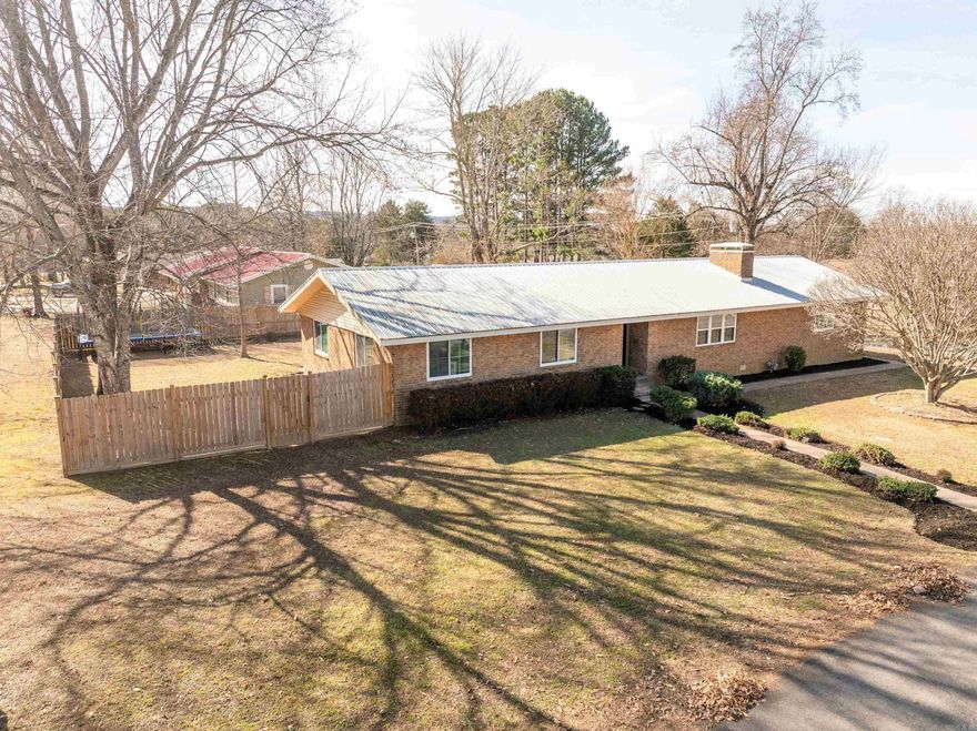 This Newly updated/remodel is 4-bedroom, 3-bath brick home in Heber Springs is within walking distance of Heber Springs schools and Sandy Beach. Home is move-in ready with recessed lighting, wood-burning fireplace, open floor plan, and an updated kitchen featuring stainless steel appliances with a butler’s pantry for extra storage. The large dining room is great for meals and gatherings and is thoughtfully tied in with the flow of the home. Home is a definite must see with four bedrooms and three full baths plus a separate laundry room offer plenty of space and convenience. While the maintenance free metal roof and insulated windows help keep your costs down, you can enjoy the privacy fence, pergola, and long decks that connect to a firepit in the spacious backyard—ideal for relaxing, entertaining or just chillin out. A true meticulous-maintained home with modern updates in a prime location. Schedule a showing today.