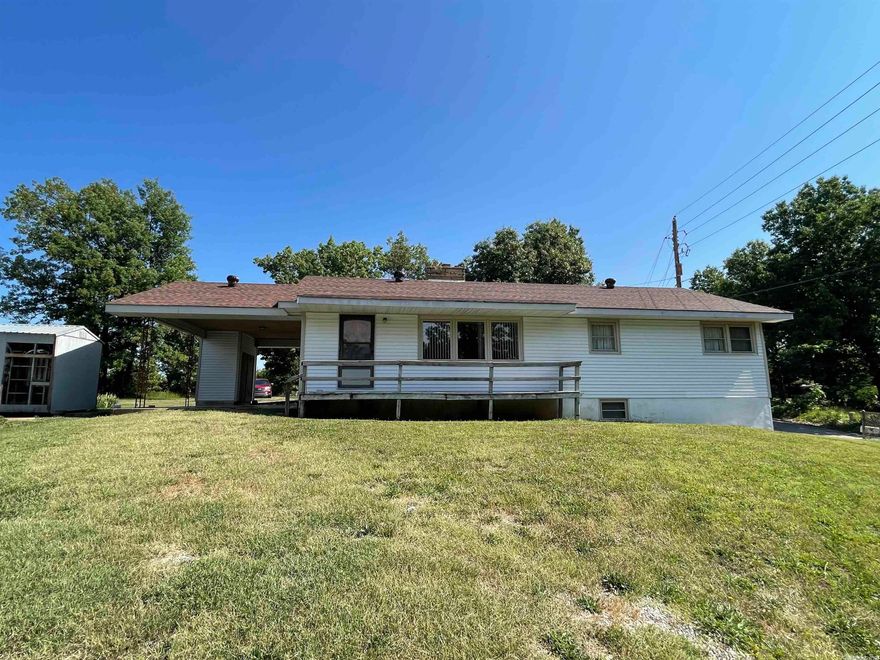 This home has lots of space.  The living room is large with a wood insert in the sandstone fireplace. The kitchen was remodeled around 2011-2012. Vinyl windows all around. Both baths are walk-in showers. It is handicap accessible with a ramp into the house and an electric stair lift to go down to the basement.  The basement is heated and cooled and has a small kitchen area that was used for canning.  The washer/dryer is in the basement. New roof and partial siding in 2022. Septic is approximately 2 yrs old. The well is still attached to the outside water faucet for outside watering. The kitchen was remodeled around 2011-2012. There is a garden area and outside storage.  The underground storage does leak in hard rains.  The lot is partially wooded and has fruit trees in the yard. Great location and is centrally located between Highland and downtown Hardy.