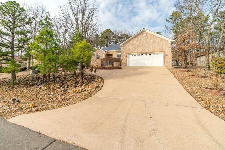 Winter mountain view home with sooooo many extras! Generac generator, multiple garage built ins, mini split AC in garage, gorgeous wrought iron fence for both front and back patios, custom rock landscaping. Enjoy this open floor plan home with no yard maintenance! Split bedrooms for extra privacy. Huge primary walk in closet with built ins. ALL appliances convey including NEW washer and dryer, kitchen fridge, laundry room fridge, and tall upright garage freezer!! Gorgeous rock landscaping and concrete sidewalk that encircles entire property! Must see to believe! Selling AS IS.