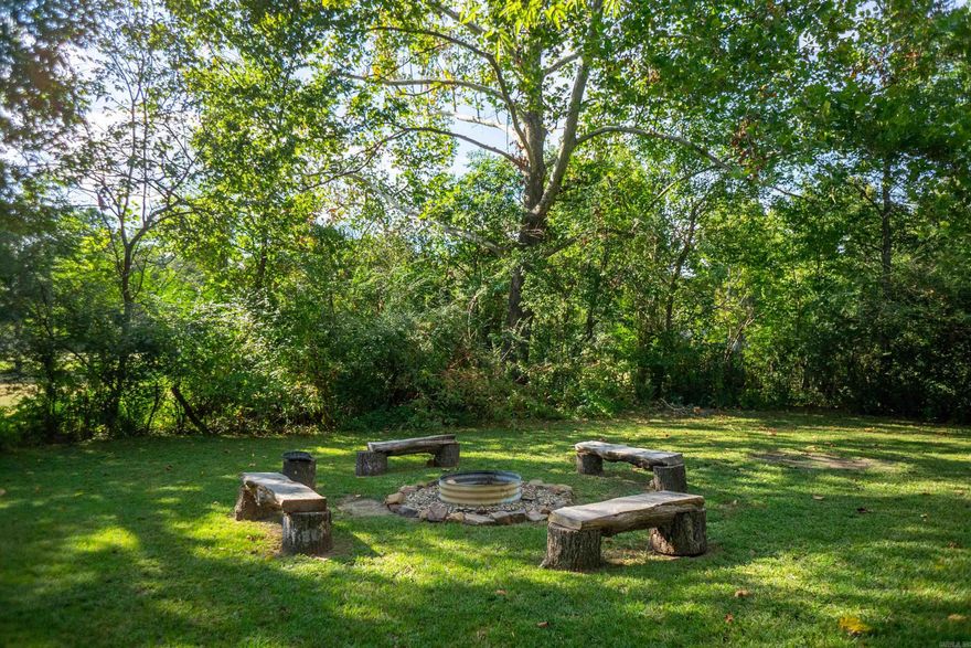 Great Lot on North West side of Mena near the proposed Mountain Bike Trails! 2/3 acre with city utilities available.  Several species of trees for plentiful shade and beauty.  Fire pit in place for your enjoyment.  3 Bed 2 bath home adjoin this acreage that can also be purchased.  MLS#23032087